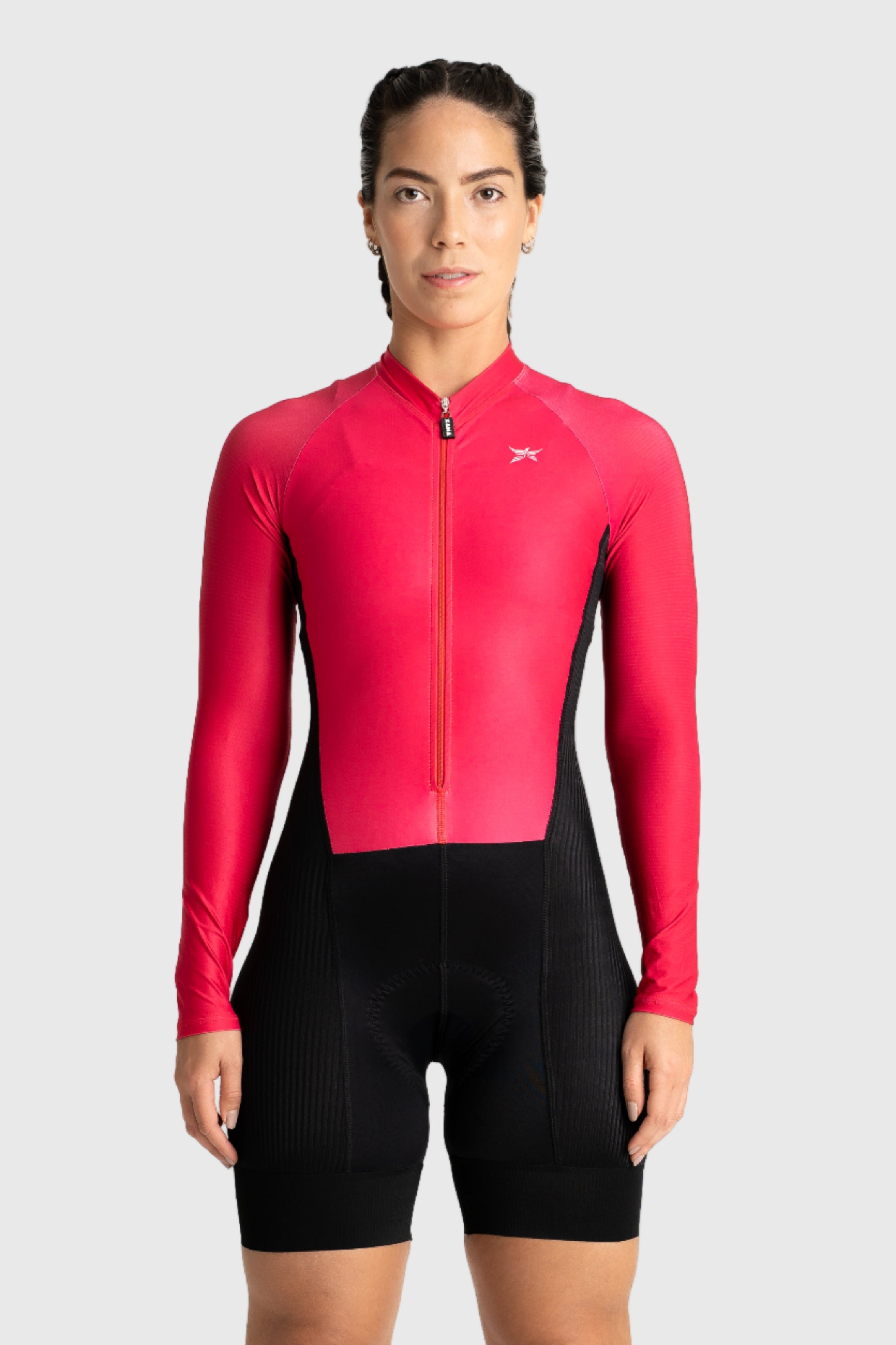 Person wearing a red cycling suit on a white background