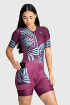 Woman wearing a purple and blue patterned athletic outfit on a white background