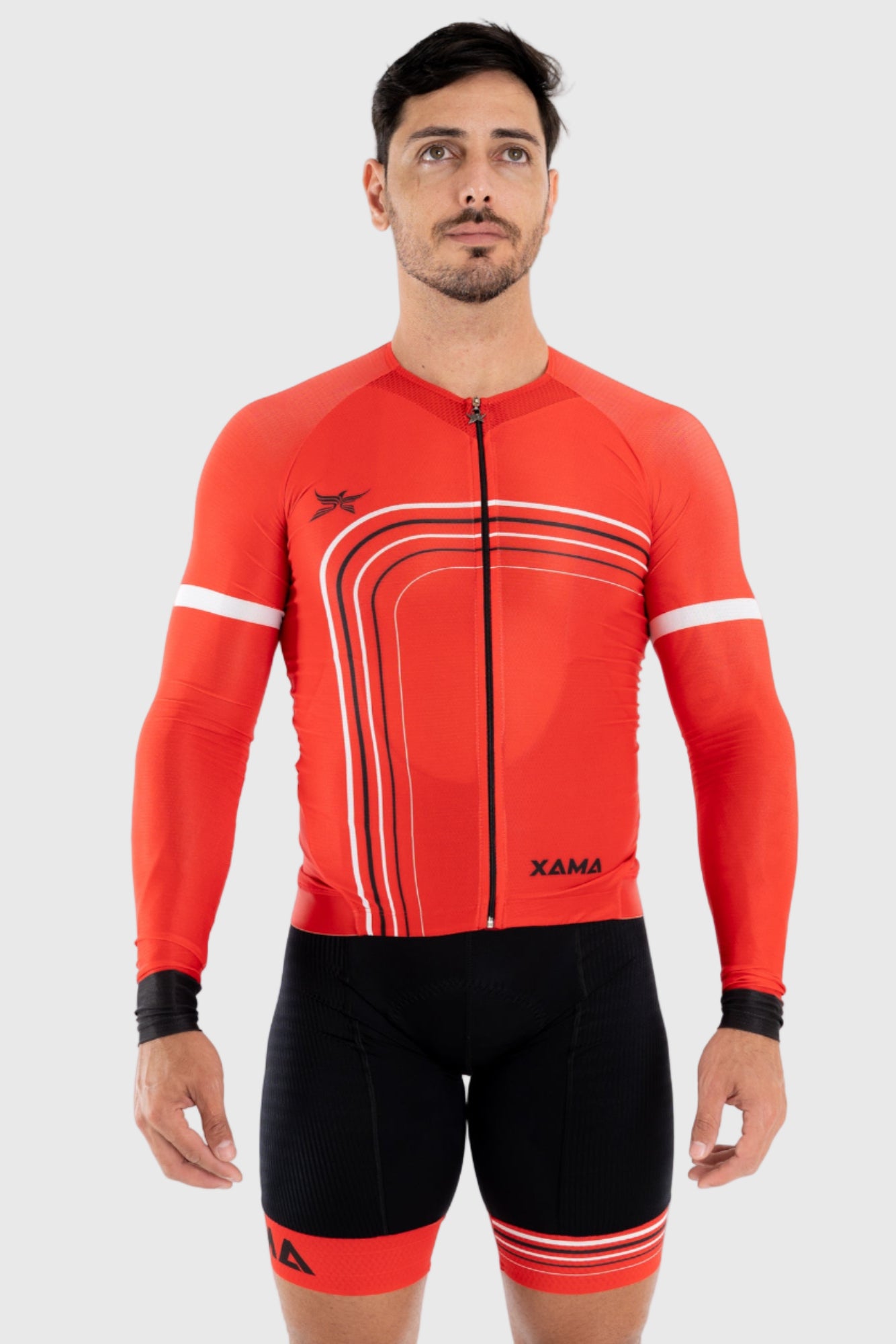 A man wearing a red, white, and black striped cycling top with short sleeves and a zipper in the front.