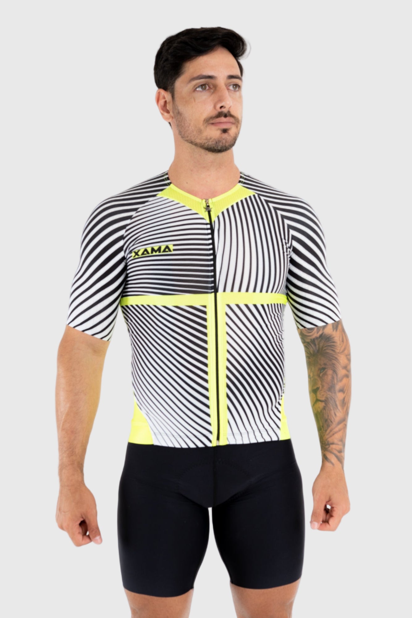 A man wearing a black and yellow striped cycling top with short sleeves and a front zipper.