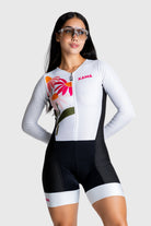Person wearing a white and black cycling outfit with colorful accents on a white background