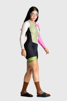 Person wearing a colorful cycling outfit with a white background