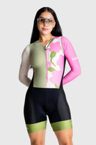Woman wearing a colorful cycling outfit on a white background