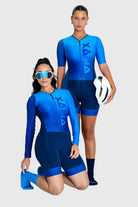 Two people wearing blue athletic suits with 'Xava' branding on a white background