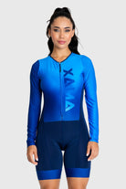 Woman wearing a blue cycling suit with 'Xala' branding on a white background